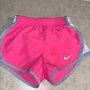 24M pink, white Nike running shorts